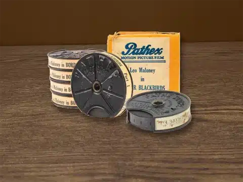 Vintage Pathé 9.5mm motion picture film reels and film box