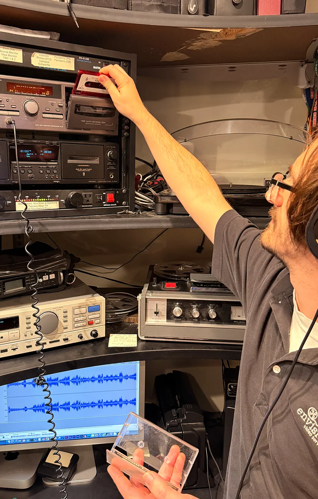 Envision Video Services technician digitizing an audio cassette using professional transfer equipment